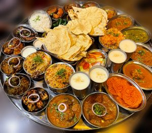 Indian cuisine including rice, chicken, naan, biryani, and other food items.
